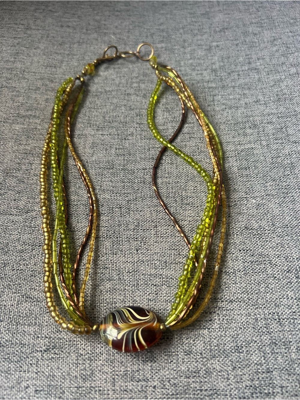 Handcrafted Green Beaded Multi-Strand Necklace with Swirl Glass Pendant